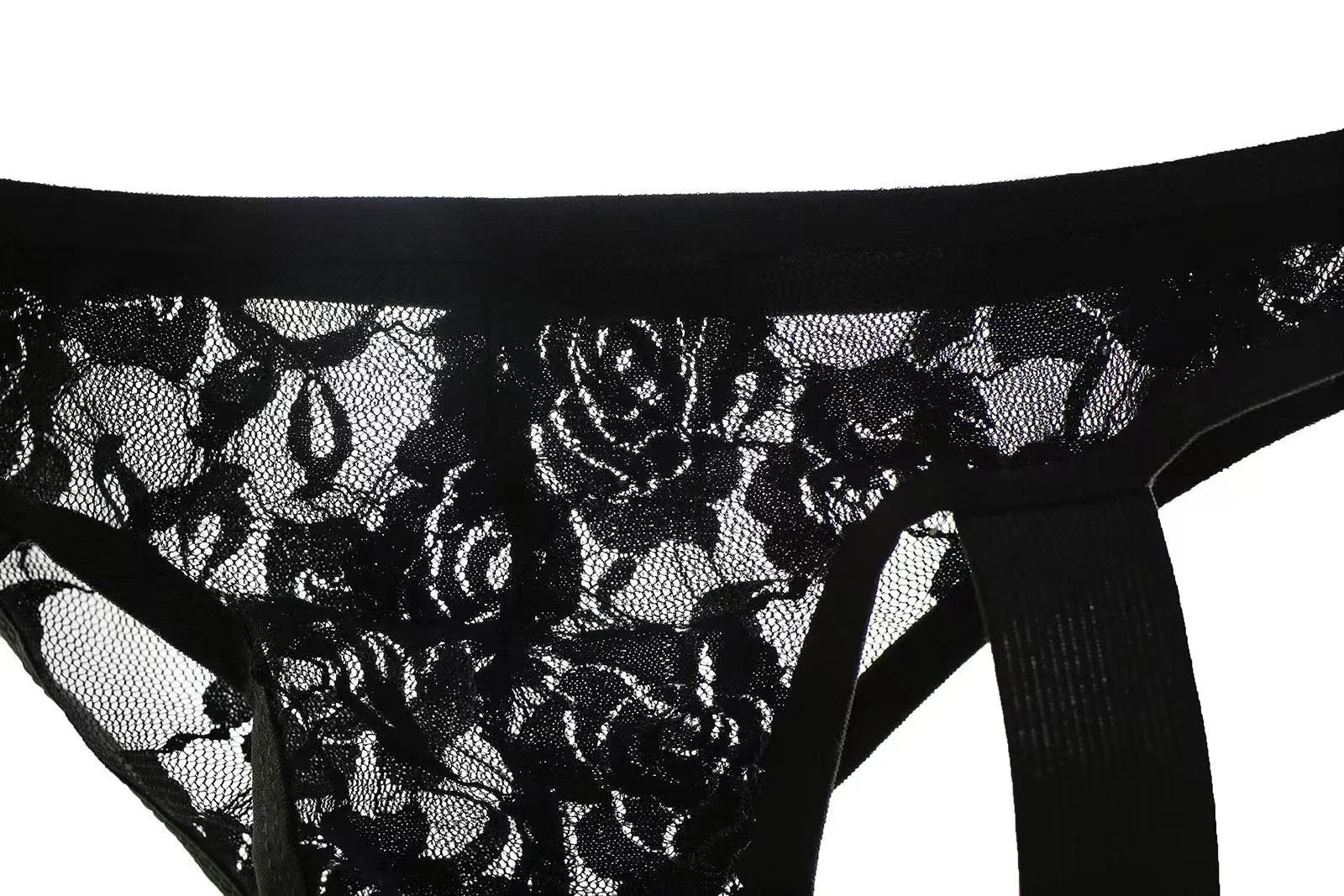 Close view of black sheer lace material on men’s thong for gay men